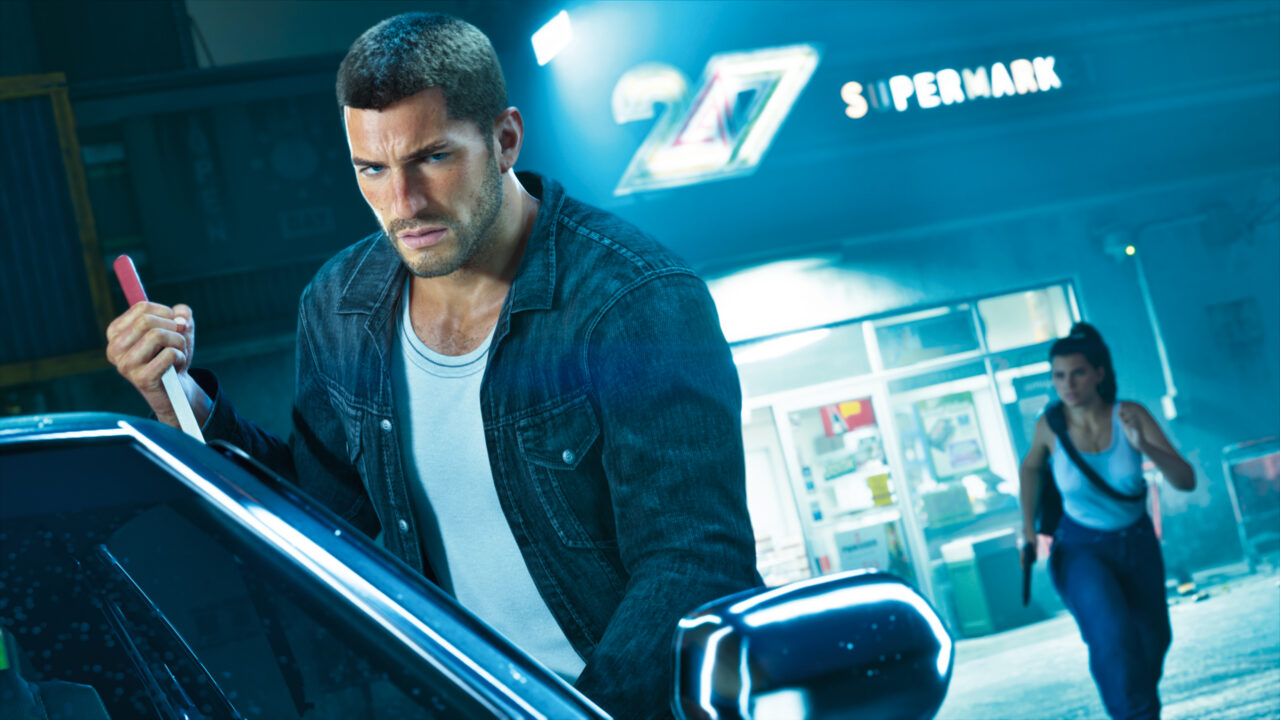 Jason neben einem Auto vor einem Laden